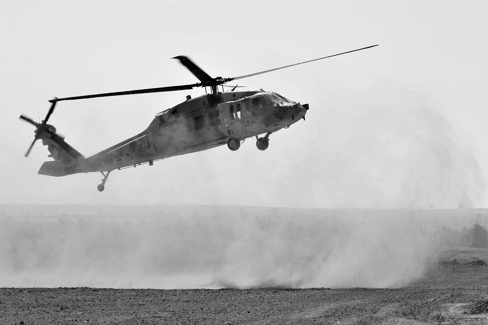 A military helicopter taking off.