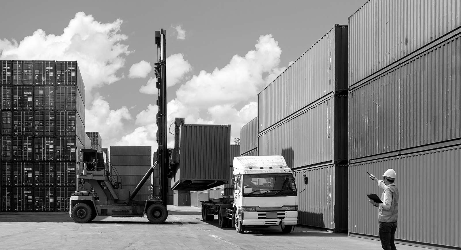 A ship yard full of shipping containers.